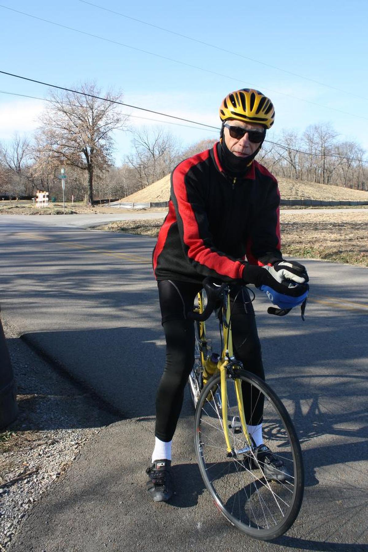 O’Fallonite Harlan Gerrish, 70, breaks from his ride on Bethel Road near the intersection of Witte and Bethel roads in rural O’Fallon where construction is ongoing for Bethel Road Bridge, one of the four bridges, for the Troy-O’Fallon Bike Trail Connector project which will be installed later this year.