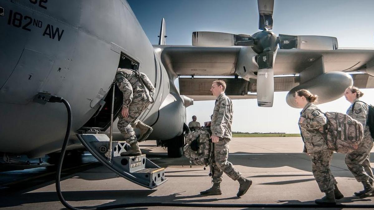 Airman from the 168th Air Support Operations Squadron, Peoria, Ill., load into a C-130 Hercules from the 182nd Airlift Wing, Peoria, Ill., to be transported to Alpena Combat Readiness Traning Center, Alpena, Mich., to participate in Exercise Northern Strike 2015.