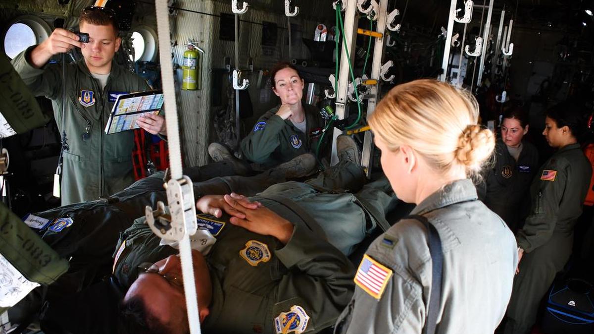 Just before take off, 932nd Aeromedical Evacuation Squadron medical members make final arrangements secure the load, as they work together, preparing to fly with “simulated patients” during a recent training flight at Scott Air Force Base. The AES went through multiple checklists as they trained alongside fellow nurses and medical technicians from active duty, on a multi day flight aboard a C-130 aircraft visiting from the 910th Airlift Wing of Youngstown, Ohio. The 932nd Airlift Wing is a 22nd Air Force unit, under the Air Force Reserve Command, and is located at SAFB. Photo by Lt. Col. Stan Paregien