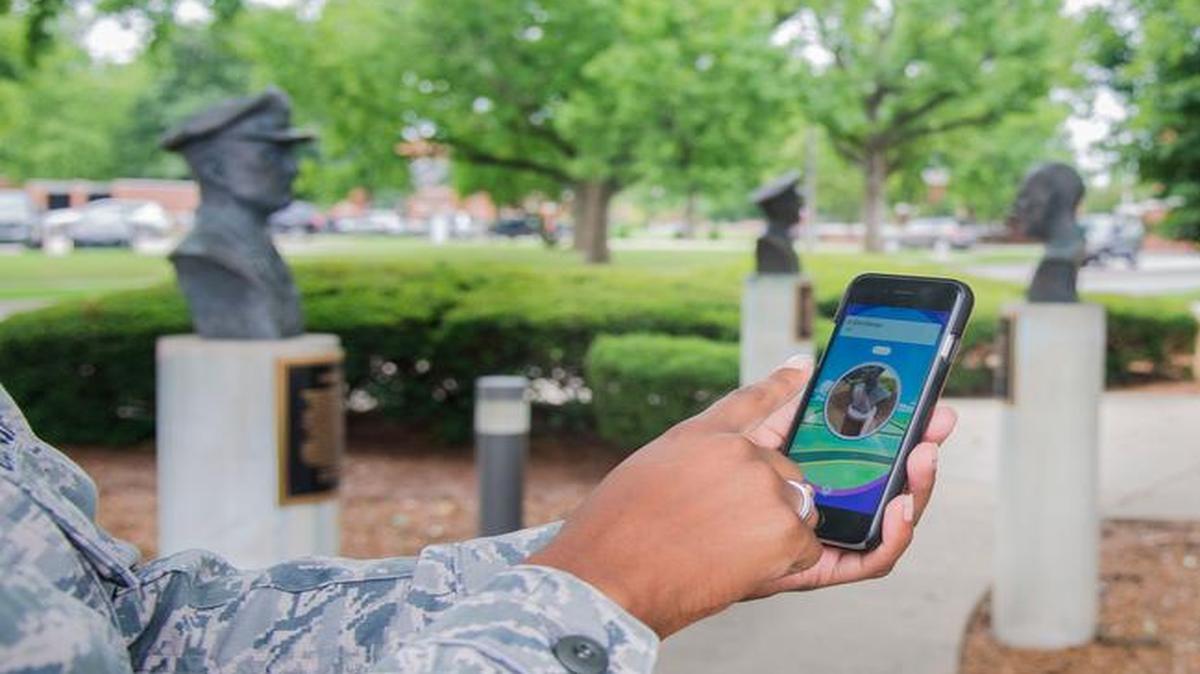 An Airman activates a PokéStop on the phone app Pokémon Go at Scott Air Force Base. The app released July 6 in North America and has been downloaded by over 75 million people worldwide.