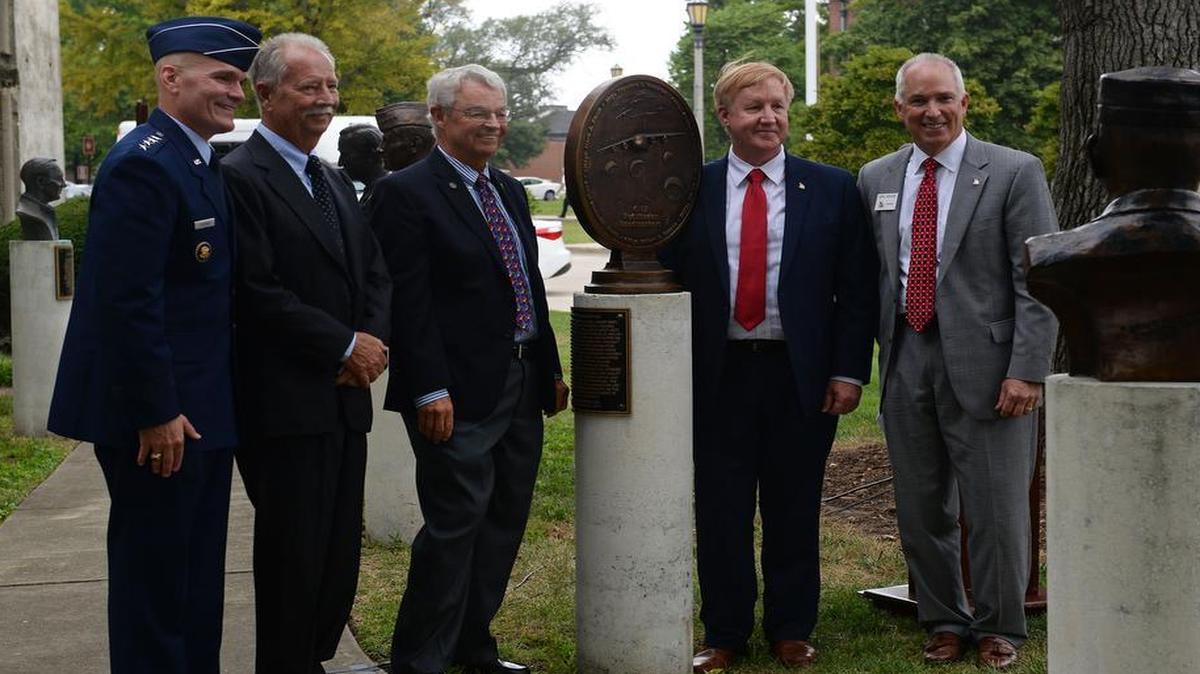 Three of six “Pathfinder Loadmasters” unveil a bronze medallion commemorating their accomplishments in revolutionizing C-17A operations for the Air Force. Presiding during the ceremony was Gen. Carlton D. Everhart II, commander Air Mobility Command. Pictured with him are retired Chief Master Sgts. James Lis, Michael Welch, Mark Smith, and Mike Kerver, President of the Airlift/Tanker Association.