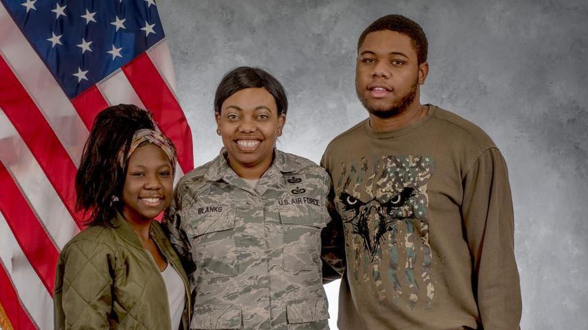 Nyla and Tyran stand with their mother, Tech. Sgt. Shonda Blanks, 375th Operations Support Squadron. Blanks knows her family is close, and possibly even closer after the unexpected passing of her daughter and her children’s sister, Iyana, from Sickle Cell Disease. As a family, they are each other’s rocks and represent the strength and resiliency that many military families face.