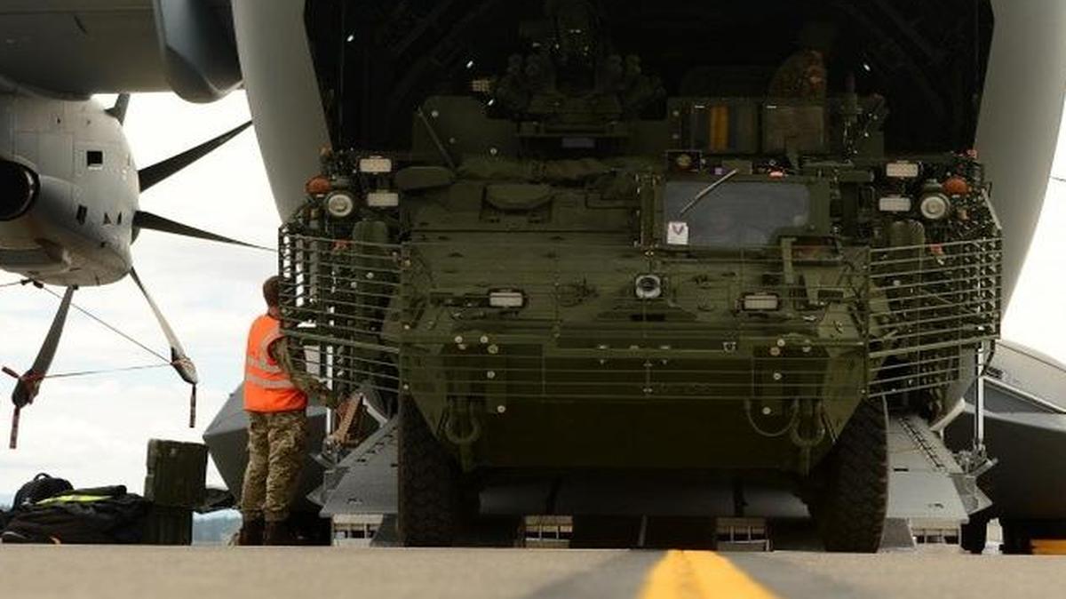 A Stryker vehicle is backed onto a Royal Air Force A-400M aircraft by 1st Stryker Brigade Combat Team Soldiers on the McChord Field flightline at Joint Base Lewis-McChord, Wash., in preparation for Mobility Guardian, which is from July 30-Aug. 12.