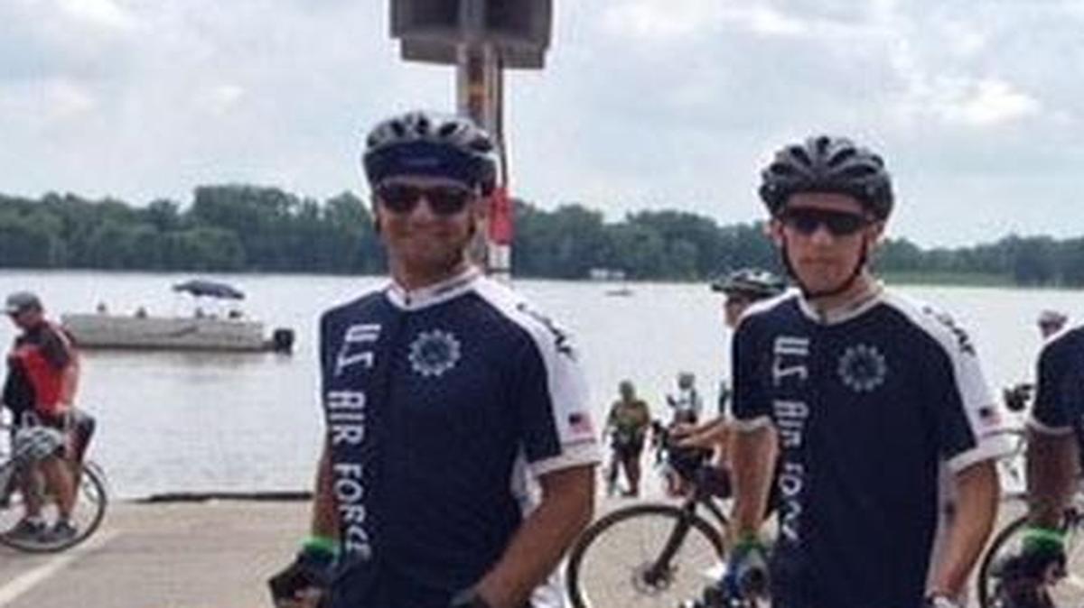 (From left), Capt. Jeff Leicy, 458th Airlift Squadron; Capt. Sean McGee, 458th Airlift Squadron; Lt. Col. Thomas Black, 618th Air Operations Center; Lt. Col. Vince Zabala, Air Mobility Command; and Loren Duffy, General Services Administration, represent the Air Force Cycling Team from Scott AFB after they completed their mission at the banks of the Mississippi River in Muscatine, Iowa.