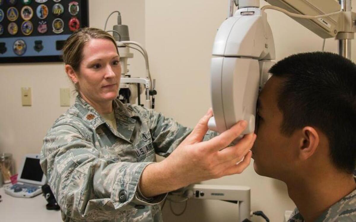 Maj. Kerry Phelan, 375th Aerospace Medicine optometry flight commander, performs an eye exam at the 375th Medical Group optometry department. Phelan will be awarded the Armed Forces Optometric Society Junior Optometrist of the Year 2016 on Nov. 8 at the AFOS annual meeting in Anaheim, Calif.