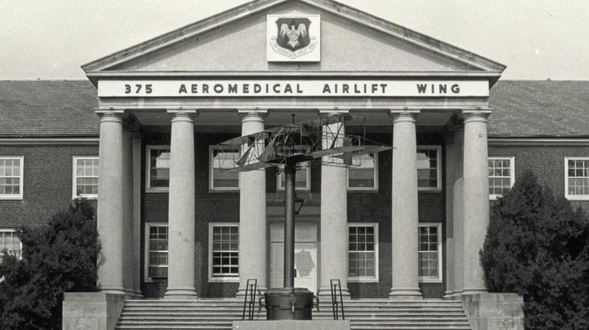 DEDICATION: A granite memorial to Cpl. Frank Scott was dedicated in front of the then-375th Aeromedical Airlift Wing Headquarters, or building P-3, July 20, 1976. He was the first enlisted person to be killed in an aviation crash. The memorial was later moved to Bldg. P-4.