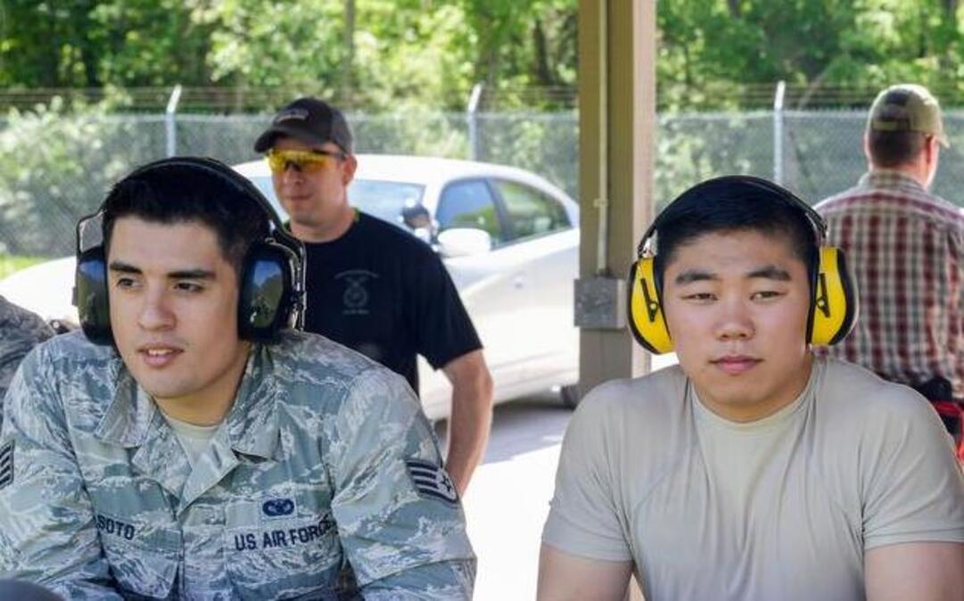 Staff Sgt. Jose Soto, Airman 1st Class Jordan Basilicato, and 1st Lt. Christopher Gresham of the 375th Security Forces Squadron watch as participants of the Police Week Shooting Competition compete at the O’Fallon and Fairview Heights Police Department Range. Members from both military and civilian law enforcement tested their shooting skills at the firing range.