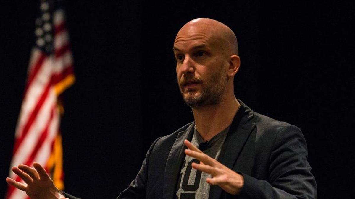 Leon Logothetis, author of “The Kindness Diaries,” speaks to audience members during a morale event at Scott Air Force Base. Logothetis spoke about his journey circumnavigating the globe, relying only on the kindness of strangers to help him.