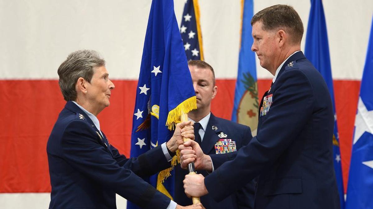 Gen. Ellen M. Pawlikowski, Air Force Materiel Command Commander, passes the Air Force Sustainment Center guidon to Lt. Gen. Donald E. “Gene” Kirkland during a change of command ceremony Aug. 7 at Tinker Air Force Base, Oklahoma. Kirkland assumed command from Lt. Gen. Lee K. Levy II, and Pawlikowski was the presiding official of the ceremony. Photo by Kelly White