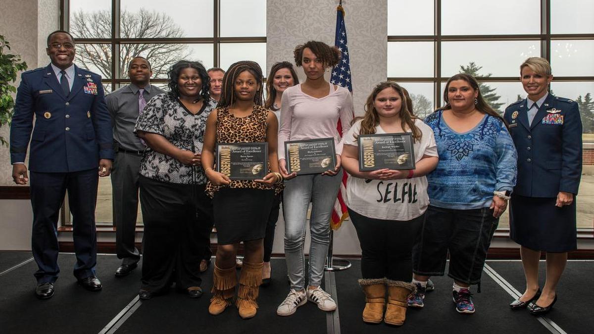 Raven Spears from Mason-Clark Middle School, Rhylea Johnson from Shiloh Middle School, and Kayleigh Weilder from West Jr. High School were presented with an award of excellence from Brig. General Stacey Hawkins, Director of Logistics, Engineering and Force Protection, Headquarters Air Mobility Command, and Col. Laura Lenderman, 375th Air Mobility Wing Commander, during the Martin Luther King Jr. Luncheon Jan. 12 at the Scott Event Center. Each student was recognized for winning their school’s essay writing contest about what King’s legacy meant to them personally.
