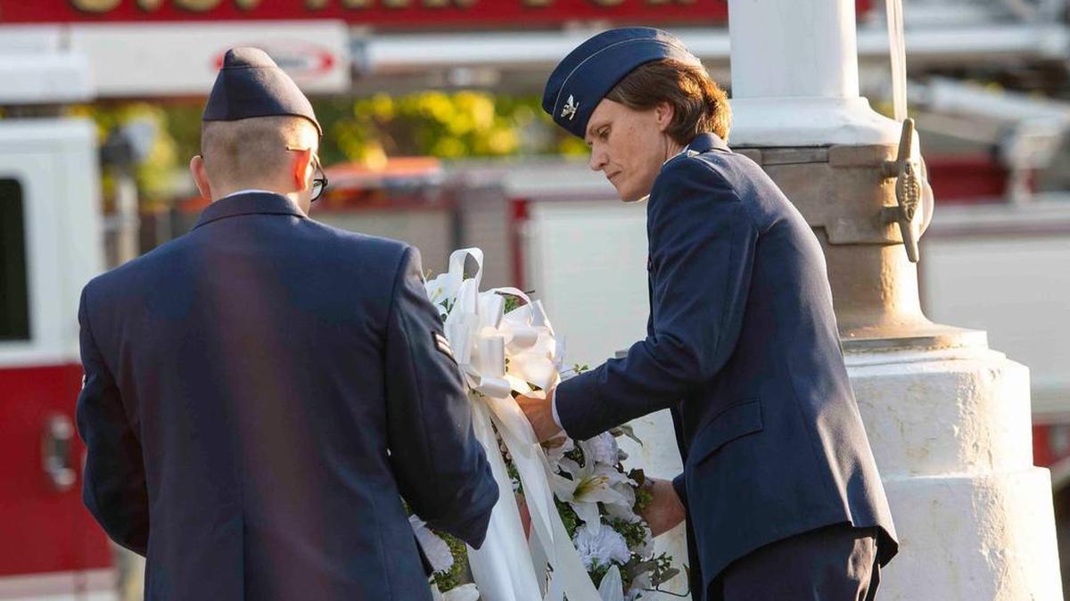 Col. Leslie Maher, former 375th Air Mobility Wing and Installation commander, and Airman 1st Class Dylan Summers, a firefighter with the 375th Civil Engineer Squadron, lay a wreath during a 9/11 memorial ceremony Sept. 11, 2018, at Scott Air Force Base. The wreath was meant to honor the 2,996 victims of the 2001 terrorist attacks. In his latest column, Terry Mackin reflects back on Sept. 11, 2001.