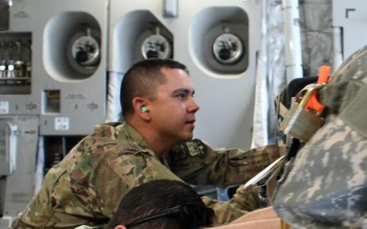 Tech Sgt. Ronald Gowen, a logistician assigned to the 387th Air Expeditionary Squadron, assists aerial porters with unloading a C-17 Globemaster III at an undisclosed location in Southwest Asia. Gowen is currently embedded with the 386th Expeditionary Logistics Readiness Squadron as he awaits transfer to a joint unit.