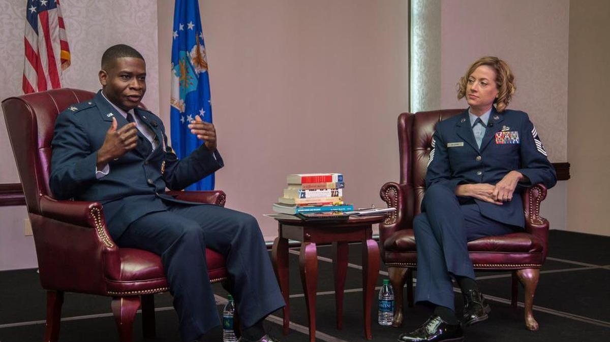 Col. Terrence Adams, Air Mobility Command director of communications, and Chief Master Sgt. Diane Slazinik, 375th Communications Group superintendent, speaks about diversity and inclusion during the Dr. Martin Luther King, Jr. luncheon Jan. 16 at Scott. The theme for this year’s celebration was “MLK 50 forward: together we win with love for humanity.”