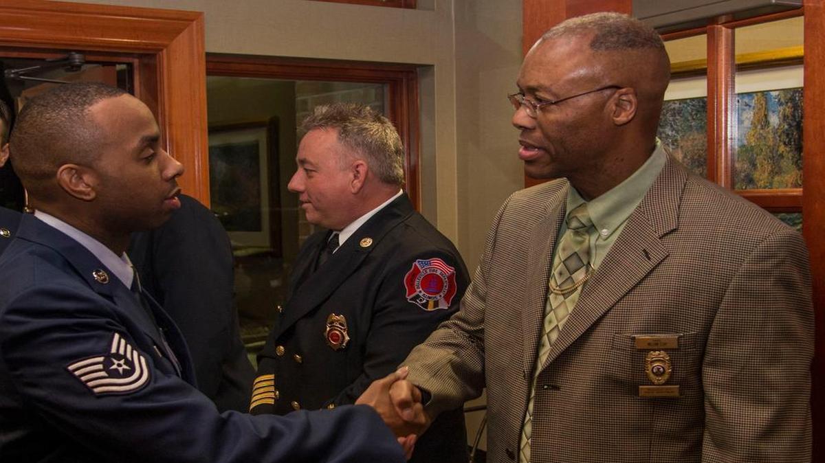 Tech Sgt. Joseph Venable, Air Mobility Command, shakes hands with William Clay, the chief of the Belleville Police Department, at Belle-Scott’s 67th annual salute to enlisted members March 9. More than 90 Airmen were recognized at the event as the group celebrated its partnership with the base and support of military members and their families. Lucas is assigned to the Air Force Network Integration Center.