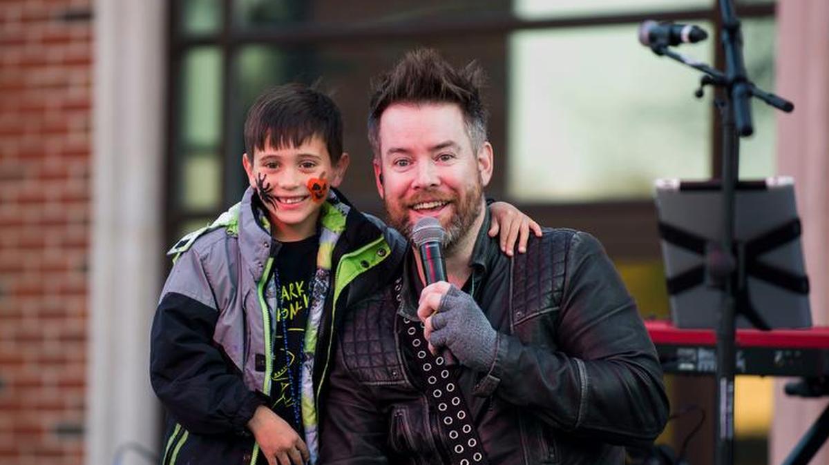 The Centennial Fall Festival at Scott Air Force Base featured a concert by 2008 American Idol winner David Cook, who poses with a young fan.