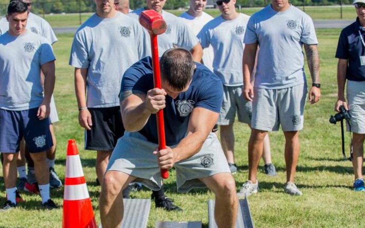 A member from the 375th CES demonstrates how to execute the Keiser Sled.Other events included, relay runs, softball, and tug-o-war.