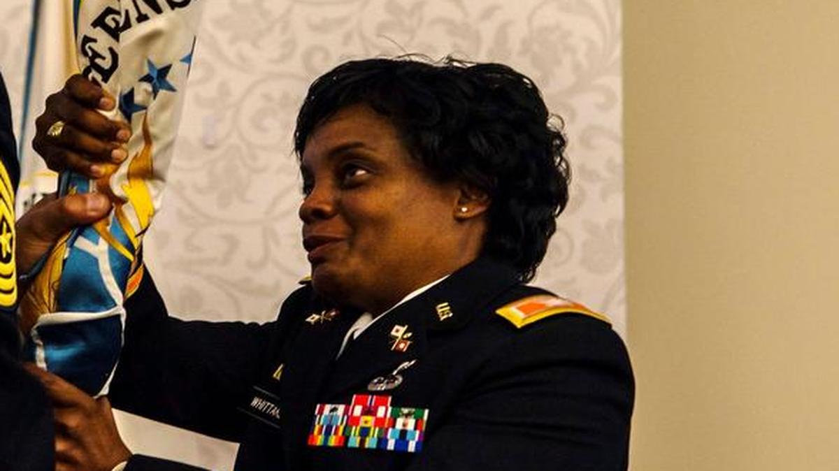 Col. Lisa Whittaker assumes command of Defense Information System Agency after Lt. Gen. Alan Lynn passes the guidon to her during a change of command ceremony July 20 at Scott. Whittaker received a commission as a 2nd Lieutenant in the Army Signal Corps upon graduation from the U.S. Military Academy at West Point.