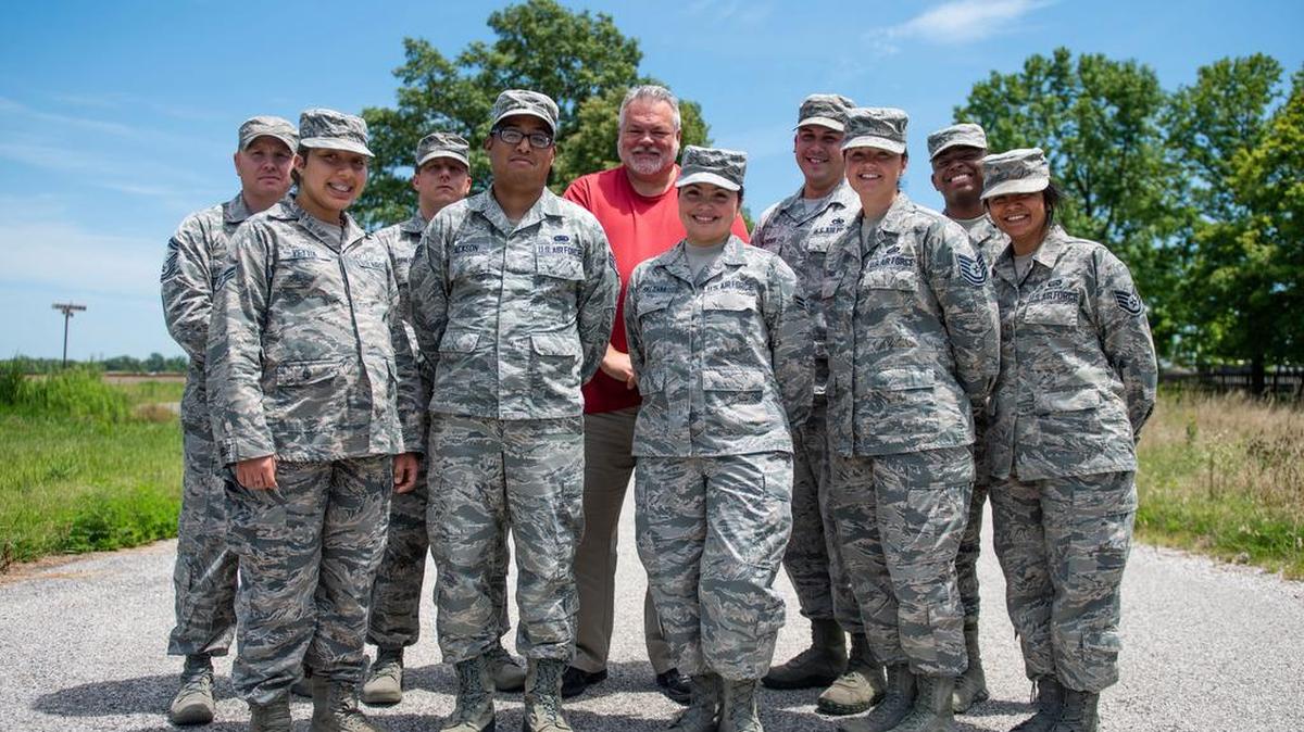 The Installation Deployment Readiness Cell poses for a group photo at Scott Air Force Base. The IDRC is responsible for processing deployments for all units at Scott AFB, as well as a few geographically separated units at Fort Campbell, Kentucky, and Andrews AFB, Maryland. Photo by Airman 1st Class Tara Stetler
