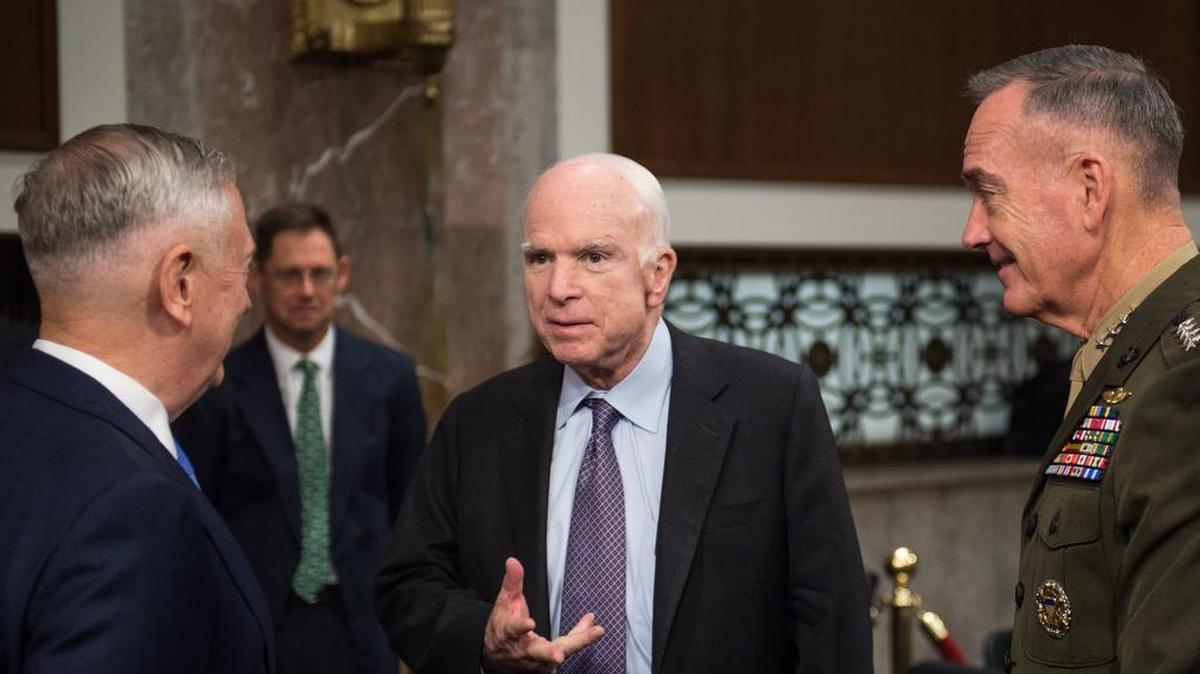 Sen. John McCain greets Secretary of Defense Jim Mattis and Marine Corps Gen. Joseph F. Dunford, Jr., chairman of the Joint Chiefs of Staff, before a Senate Armed Services Committee hearing on Capitol Hill, in 2017. Mattis and Dunford testified about the political and security situation in Afghanistan. Army photo by Sgt. James K. McCann