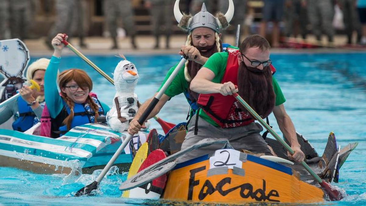 The 375th Medical Group and the 375th Comptroller Squadron race to the end of the pool during the regatta.