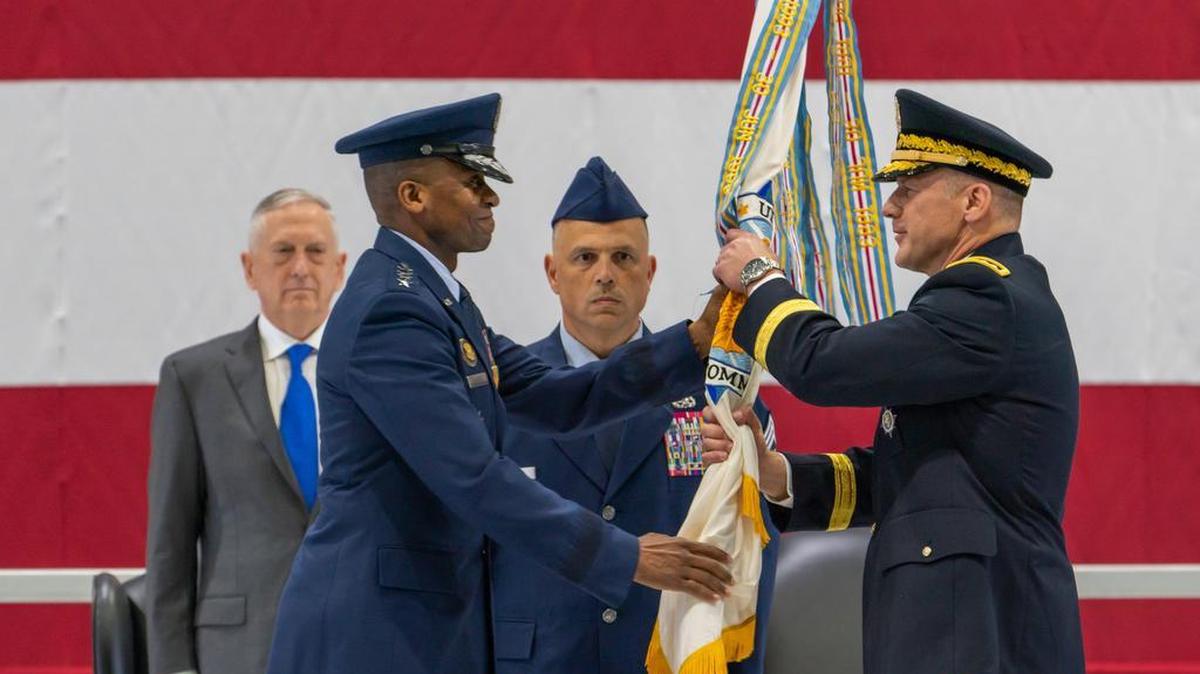 Air Force Gen. Darren W. McDew passes the U.S. Transportation Command guidon to Army Gen. Stephen R. Lyons during a change of command ceremony Aug. 24 on Scott Air Force Base. Lyons is the first Army officer to head USTRANSCOM, and will lead an enterprise of more than 144,000 logistics and transportation professionals. Secretary of Defense James N. Mattis presided over the ceremony. Photo by Staff Sgt. Oz Suguitan