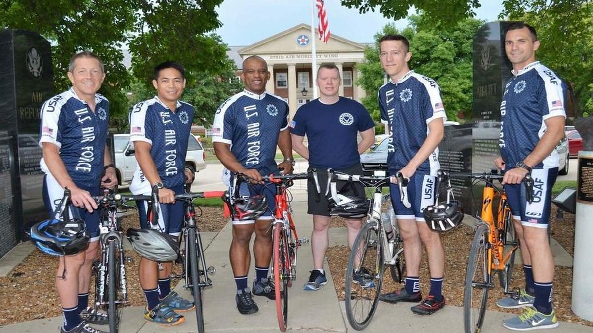 The Scott Air Force Base cycling team stands in front of the 375th Air Mobility Wing headquarters building prior to their departure. From left to right are Loren Duffy, retired Air Force Reserve Lt. Col.; Lt. Col. Vince Zabala, 618th Air Operations Center; Lt. Col. Tom Black, 618th AOC; Maj. Erik Vacarelli, 618th AOC; Capt. Sean McGee, 458th Airlift Squadron; and 1st Lt. Jeff Leicy, 458th AS.