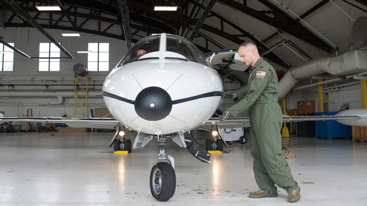 Maj. Brian Jones, 458th chief of training, works on pre-flight checks. The visual inspection or walk around is done by the pilot as the final airworthiness check.