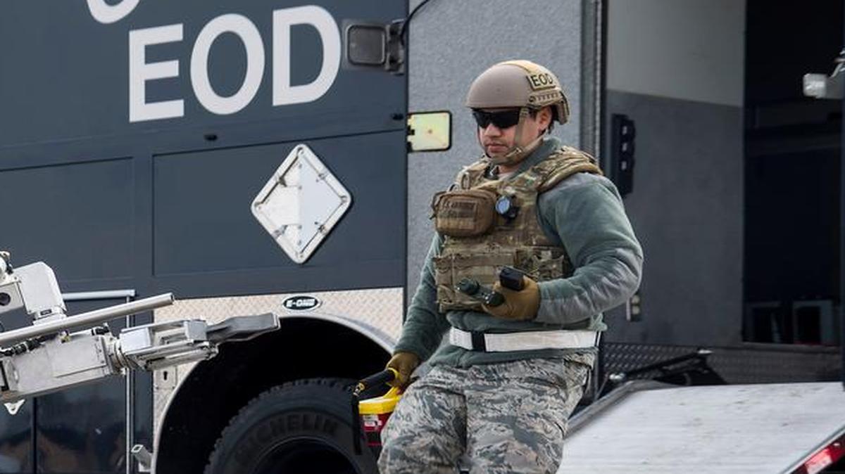 Senior Airman Emilio Solis, 375th Civil Engineer Squadron explosive ordnance disposal apprentice, prepares to attach a Victoreen 451P to the F6A EOD robot for real-time testing of the rate of exposure to radioactive material during an exercise Feb. 9 at Scott. This was an exercise to test the base’s response to an explosion with potential chemical, biological, radiological and nuclear contamination.