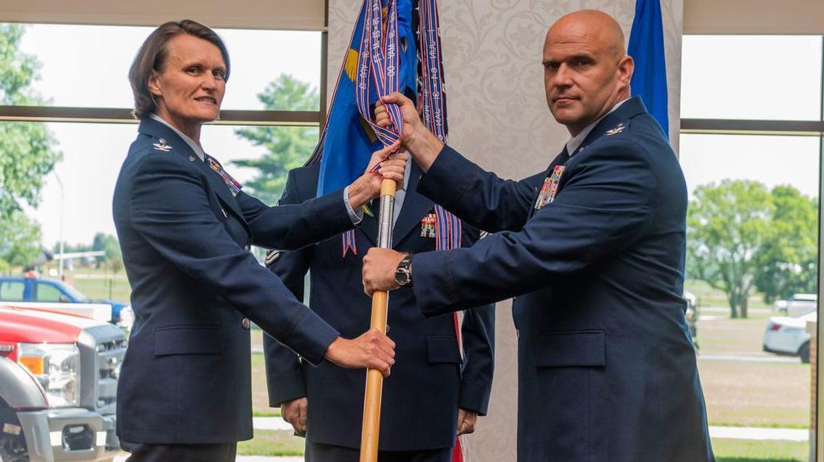 Col. Leslie A. Maher, 375th Air Mobility Wing commander, presents the 375th Mission Support Group guidon to Col. Shawn Covault during a change of command ceremony July 12 at Scott Air Force Base. Covault follows in the footsteps of Col. Robert Henderson, who served as the group’s commander from July 2016 to July 2018.