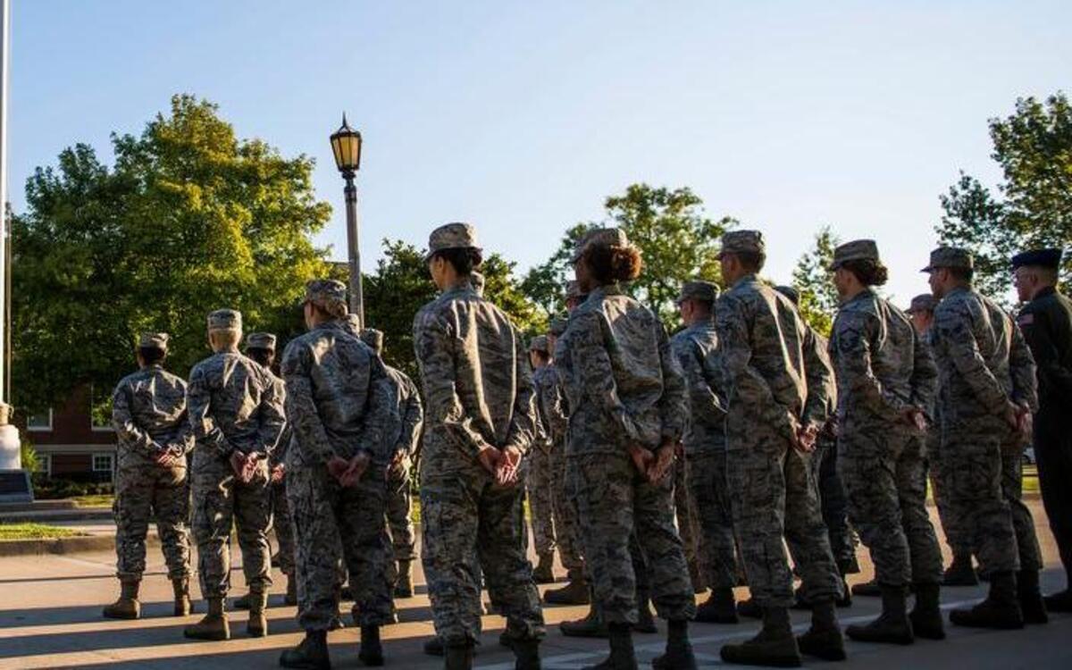 A formation stands at parade rest after the flag was raised on Sept. 11.