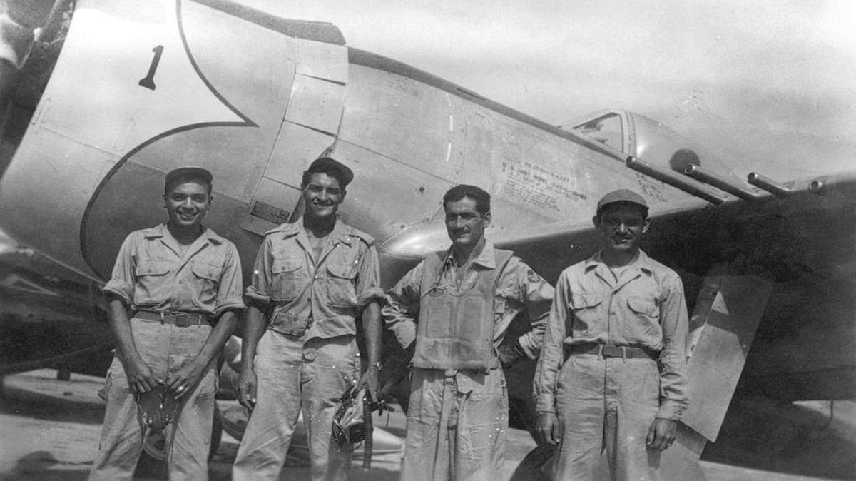 Captain Radames Gaxiola Andrade stands in front of his P-47D with his maintenance team after he returned from a combat mission.
