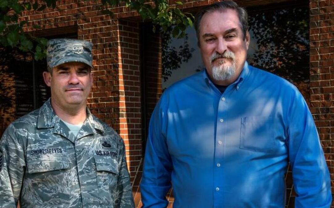 Ret. Air Force Master Sgt. Almont Shortsleeves (right), who currently works at the 618th Air Operations Center, with his son Master Sgt. Michael Shortsleeves, a member of the 375th Cyberspace Support Squadron.