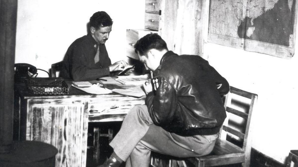 Maj. Robert Gleason (left) and Maj. Mandle work at the Army Airways communication System headquarters in Kunming, China, in the mid 1940s. This year, the Air Force Network Integration Center is celebrating 75 years of communication history.