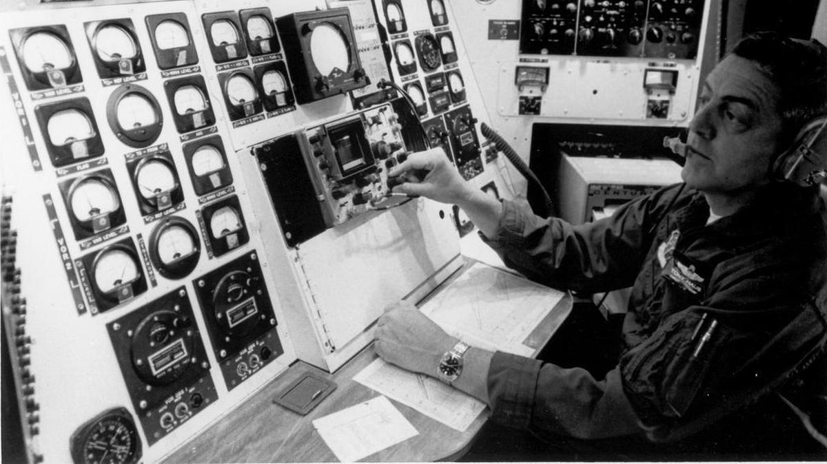 Inside view of one of Air Force Communications Command’s C-140 “Jet Star” with Chief Master Sgt. Tony Haus working the flight inspection equipment console.