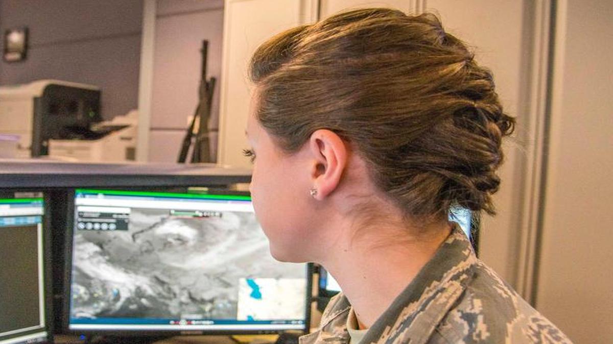 Airman First Class Bryn Franicevich, 618th Air Operations Center global mobility weather apprentice, monitors and compiles climatological data from five operational weather squadrons in support of the 618th AOC mission of commanding and controlling global air mobility operations.