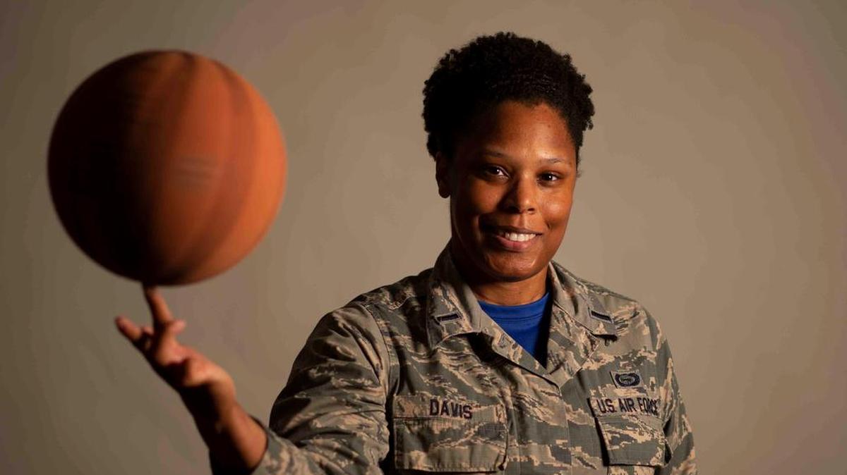 First Lt. Brittnie Davis, Air Mobility Command intelligence officer, shares how hard work and determination helped her achieve her goals of playing basketball and becoming an officer. Photo by Airman 1st Class Tara Stetler