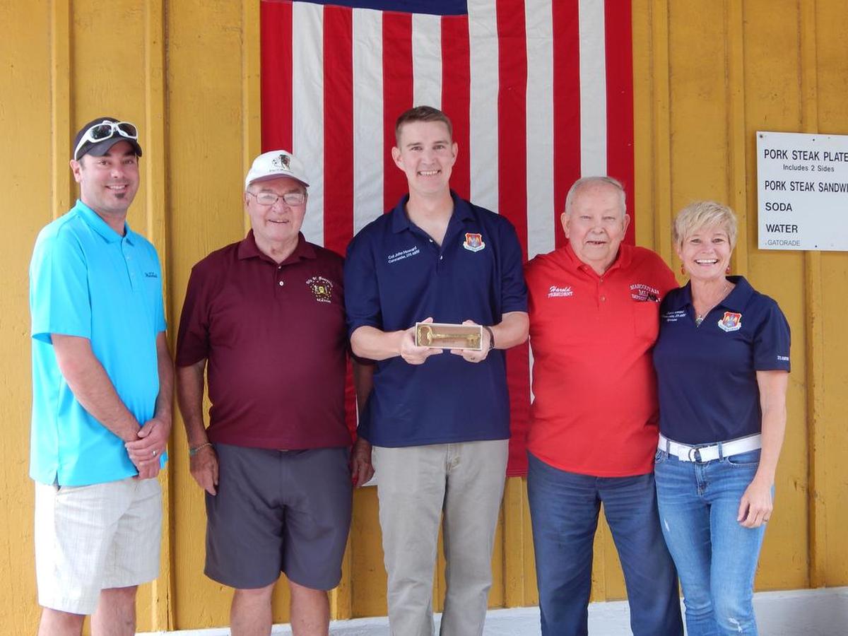 Mascoutah Mayor Jerry Daugherty, second from left, presents Col. John Howard, 375th Air Mobility Wing commander, center, a key to the city at the Mascoutah Homecoming in 2017.
