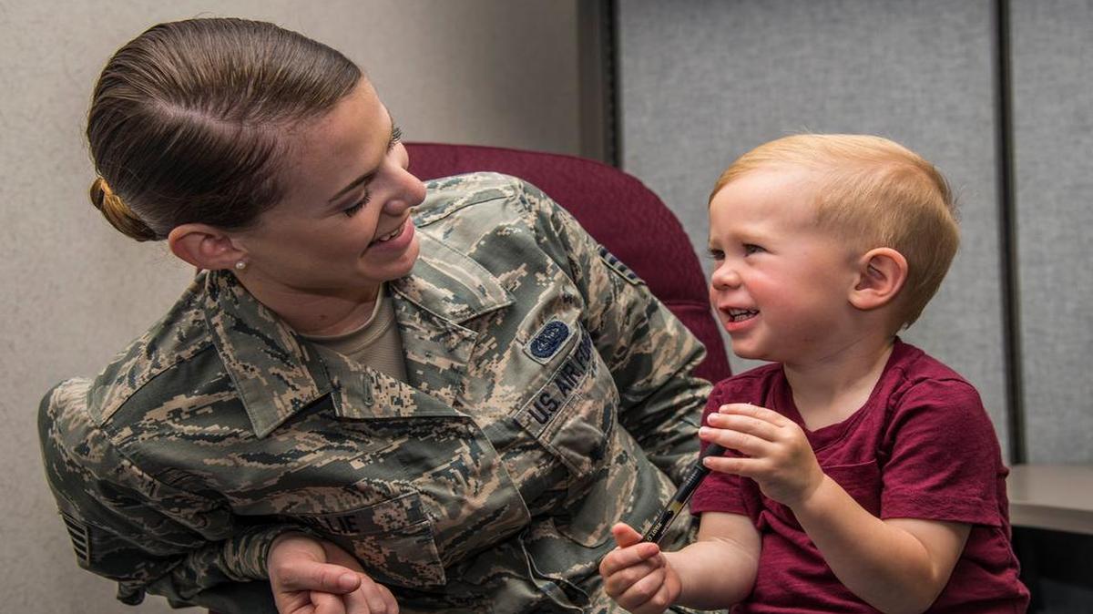 Staff Sgt. Rachel Ollie, 375th Communications Squadron, jokes with her son, Wyatt. Ollie is responsible for coordinating and managing a variety of tasks and activities, from human resources and managing calendars to arranging travel and preparing official documents.