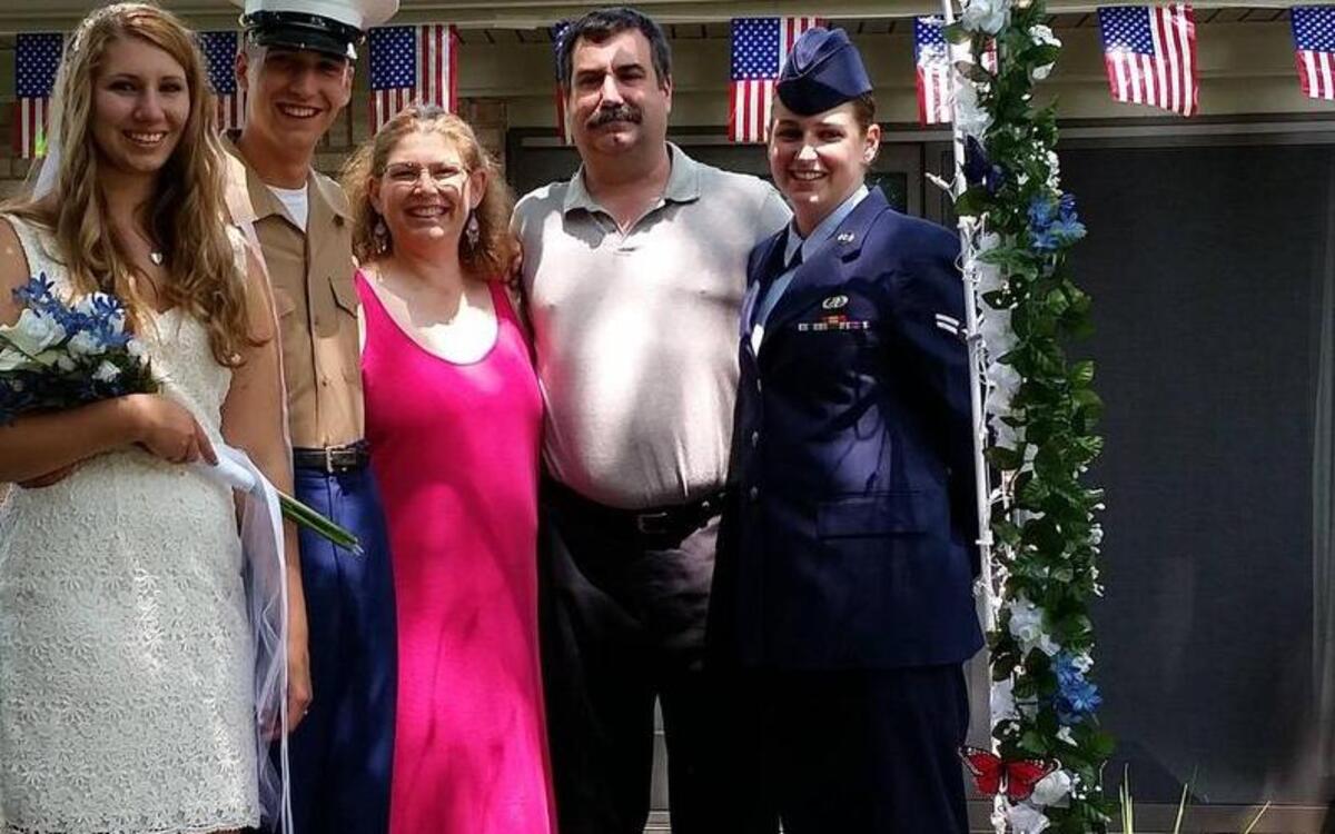 Siblings Marine Private 1st Class Vincent Savino and Airman 1st Class Lisa Savino, 375th Communications Squadron, signed to serve on the same day unbeknownst to each other. They are pictured with their parents Sherri and Joe and a family friend.