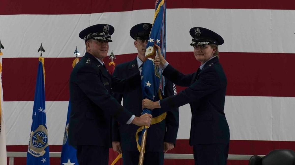 Gen. David L. Goldfein, Air Force Chief of Staff, passes the Air Mobility Command guidon to Gen. Maryanne Miller, who assumed command of AMC in a change of command ceremony Sept. 7 at Scott Air Force Base. Miller assumed command from Gen. Carlton D. Everhart II, who retires after 35 years of service to the Air Force. Photo by Tech. Sgt. Jodi Martinez