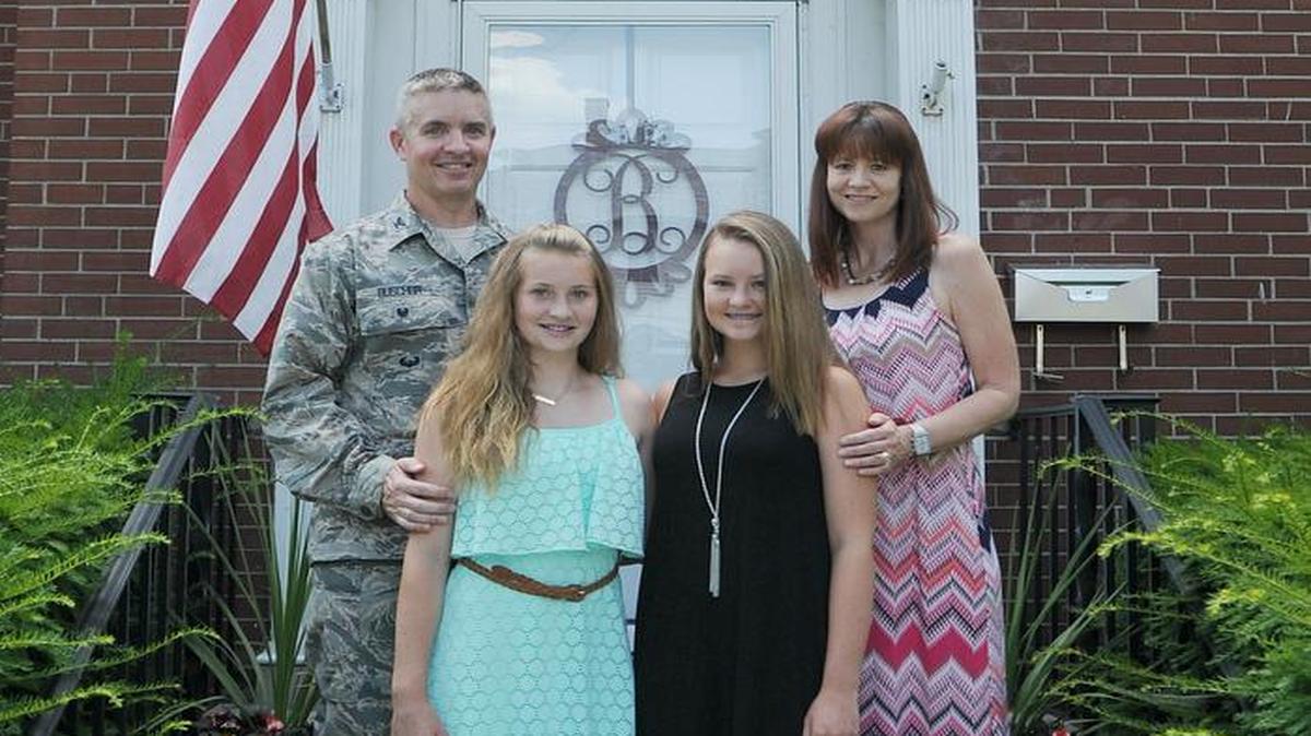 Col. Chris Buschur, the 375th AMW vice commander, with his family—wife, Sharon, and daughters, Lauren and Madison.