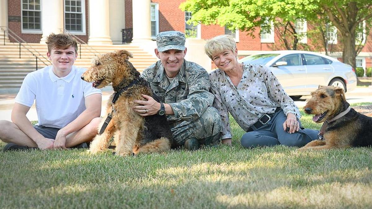 Pictured is the Howard family: Col. John Howard and wife, Dana, along with son, Kevin, and their dogs, Lucky and Cali. Their daughter, Emily, is not pictured.