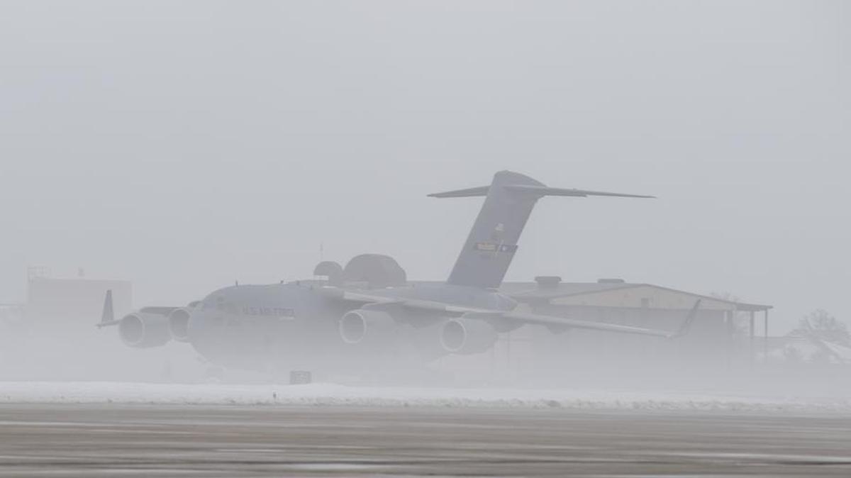 Fog surrounds a Joint Base McGuire-Dix-Lakehurst (New Jersey) C-17 Globemaster III parked on the runway at Scott Air Force Base on Jan. 17. Scott AFB and the local community were affected by heavy fog which lowered the visibility to 1/8th of a statute mile and led to delays on the flight line.