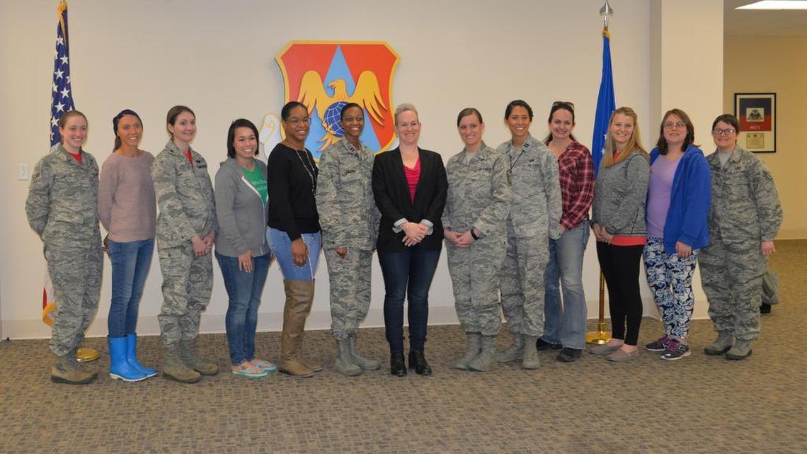 Award winning author Robyn Roche-Paull (center) partnered with Scott’s Mom2Mom organization to speak about breastfeeding in the military April 6.