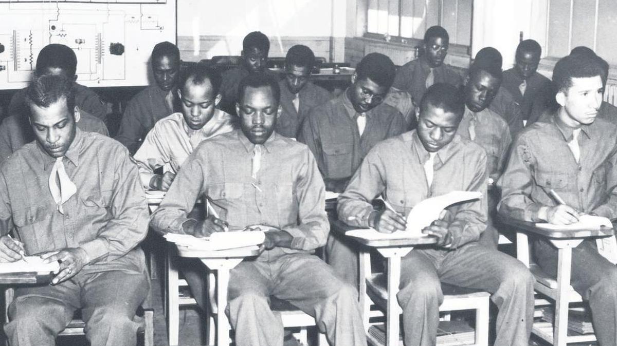 RADIO SCHOOL GRADUATES: In January 1943, 330 black servicemen, assigned to the 46th Aviation Squadron, entered the Radio School, and in May 1943, they graduated, ready to help Tuskegee Airmen fly. These radio school graduates were a part of a bigger initiative of the Army Air Forces Technical Training Command to supply black flying squadrons with sufficient support personnel, including supply, adjutant, intelligence, and statistical officers.