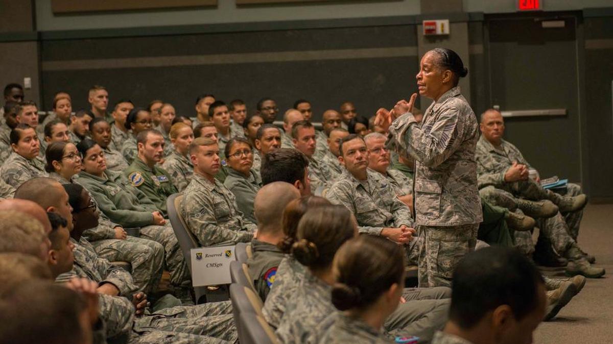 Chief Master Sgt. Shelina Frey, Air Mobility Command Command Chief, speaks with enlisted personnel during an all call at Dyess Air Force Base, Texas.
