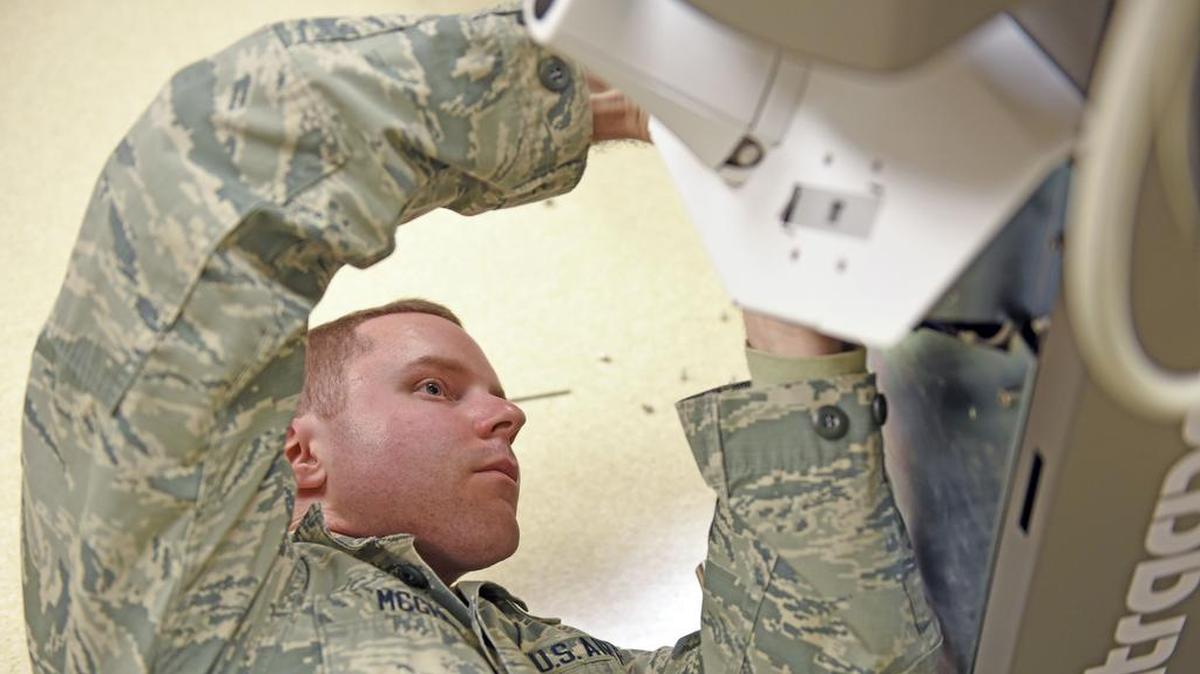 Airman 1st Class Jason McGhee, 375th Medical Support Squadron biomedical equipment technician, repairs a dermatologic laser at the 375th Medical Group Clinic at Scott Air Force Base. Without the 375th Medical Equipment Repair Center being at Scott, the base would have to rely on contractors or other bases to maintain the equipment, which could lengthen the process by weeks.