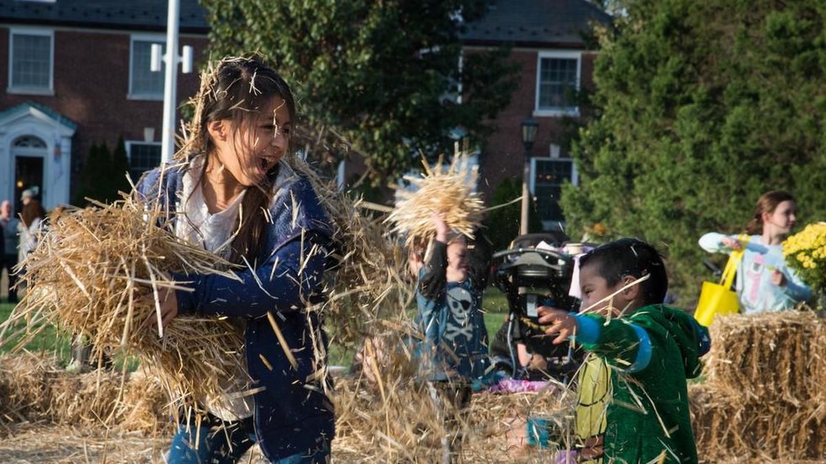 Children have a hay fight during the 2016 Fall Fest at Scott Air Force Base. This year’s Fall Festival is scheduled for Nov. 3.