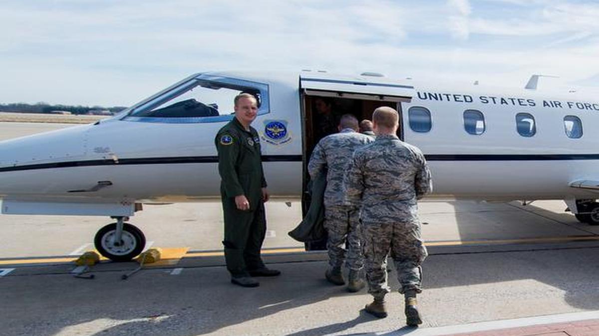 Airmen board a C-21 before takeoff Feb. 16 for their incentive flight. The Airmen spent a few hours flying around St. Louis.