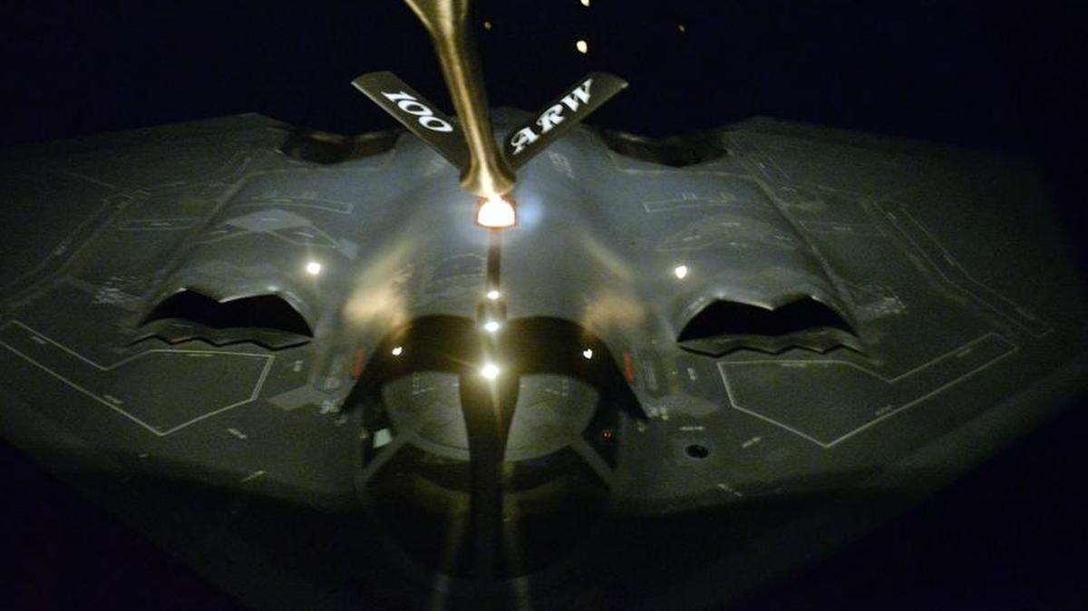A KC-135 Strantotanker from the 100th Air Refueling Wing refuels a B-2 Spirit from the 509th Bomb Wing in the late hours of Jan. 18 during a mission that targeted Daesh training camps in Libya.
